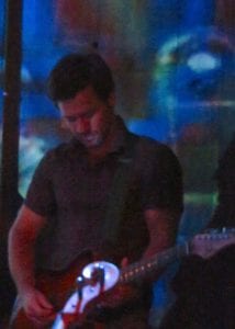 Dave Pomeranz playing guitar