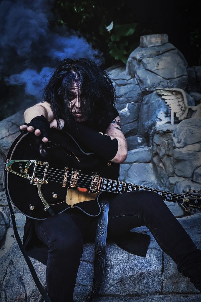 MIchael Ciravolo holding a guitar